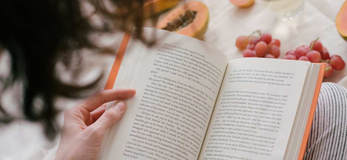 example of self-care, woman reading a book